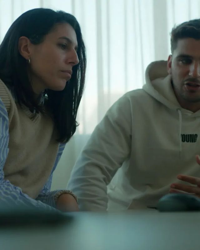 Two people building a business together at their screens